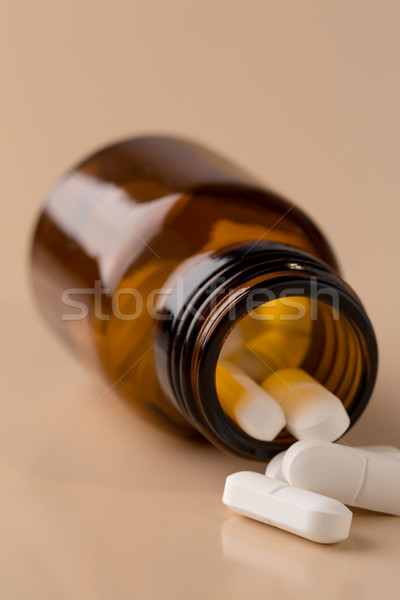 Brown glass pill bottle and white pills Stock photo © ironstealth