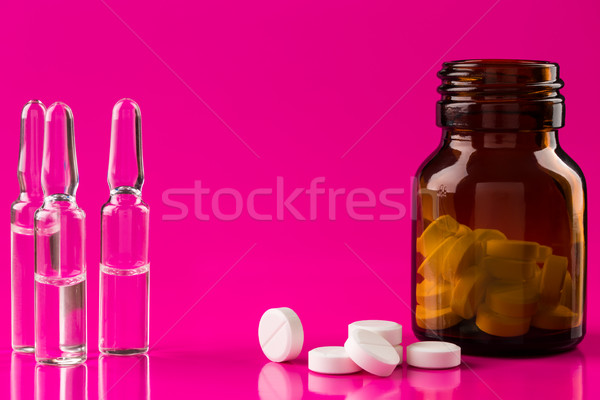 Brown glass pills bottle and three medicine ampules Stock photo © ironstealth