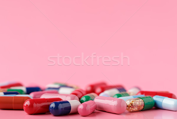Heap of various pills on color background Stock photo © ironstealth