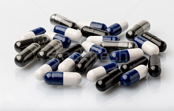 Foto stock: Médicos · dosis · cápsula · negro · azul