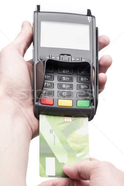 Man's hand holding a bank card on POS-terminal Stock photo © ironstealth