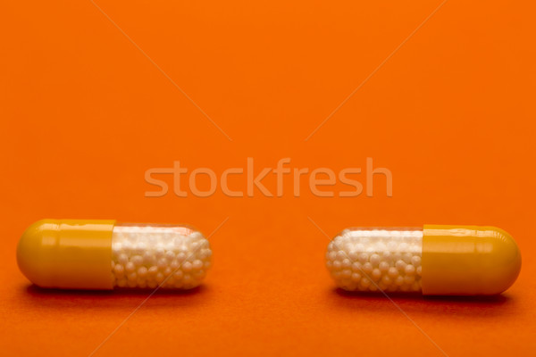 Yellow medical capsules with text space Stock photo © ironstealth