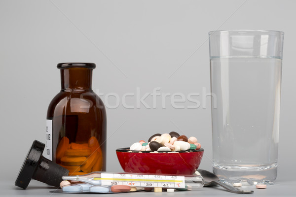 Various pills,medical bottle and glass of water Stock photo © ironstealth