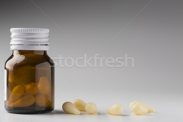 The bottle is brown glass with suppositories for treatment of prostatitis. Stock photo © ironstealth