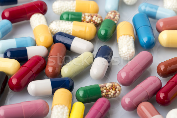 Stock photo: Heap of colorful medical pills and drugs
