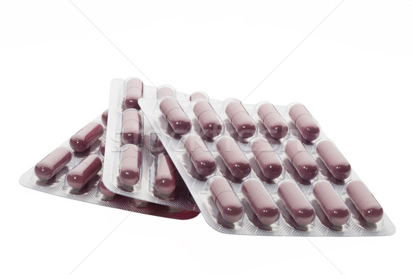Set of brown pills in a blister pack on white background Stock photo © ironstealth