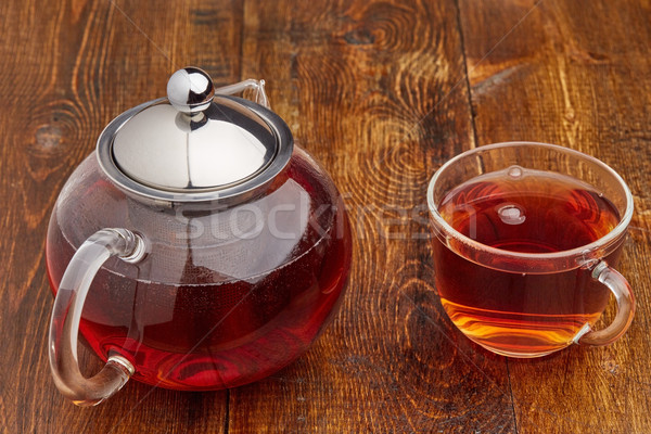 Set of glass teapot and cup of black tea Stock photo © ironstealth