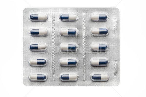 Dark blue capsules in blister pack closeup isolated Stock photo © ironstealth