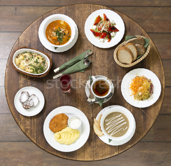 Stock photo: Business lunch on a vintage round table. Wednesday