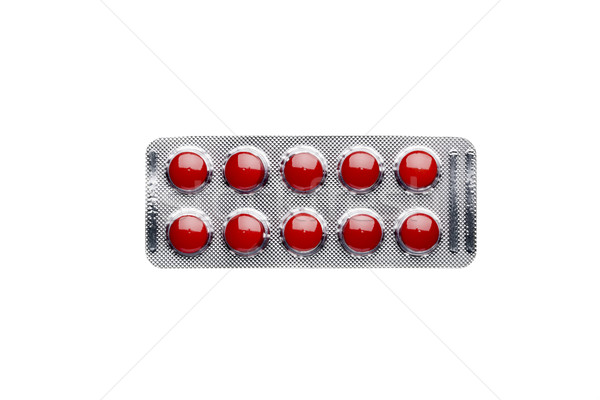 Red pills in blister pack isolated on white background Stock photo © ironstealth