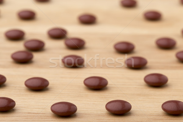 Close up brown pills on wooden table background Stock photo © ironstealth