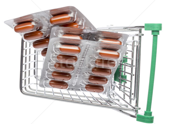 Shop cart with brown capsules blisters  Stock photo © ironstealth