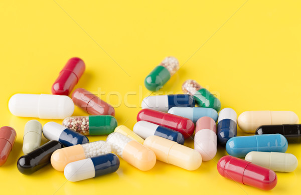 Heap of various pills on color background Stock photo © ironstealth