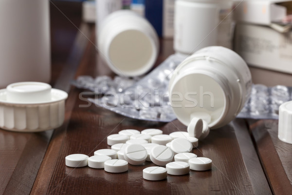 White pills and empty pill bottles Stock photo © ironstealth