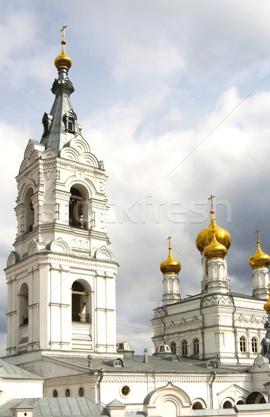Stock photo: Christian temple with domes on a background of clouds
