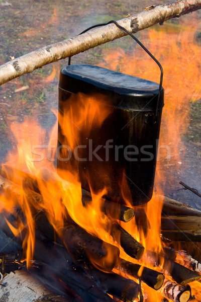 Cooking in a kettle on a fire. Stock photo © ISerg