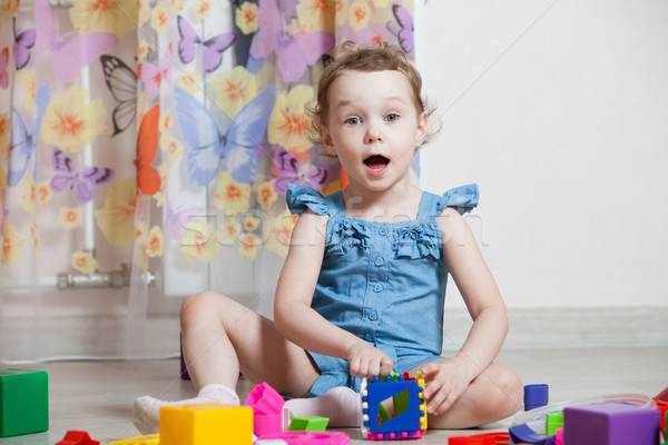 beautiful girl plays toys in room Stock photo © ISerg