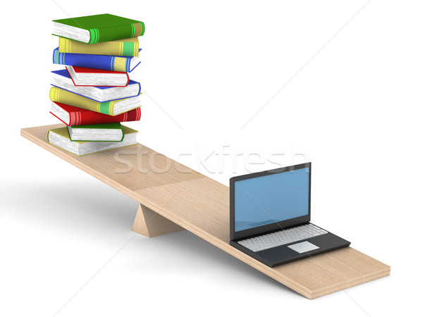 Books and laptop on scales. Isolated 3D image Stock photo © ISerg