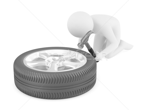 Stock photo: man repairs wheel. Isolated 3D image