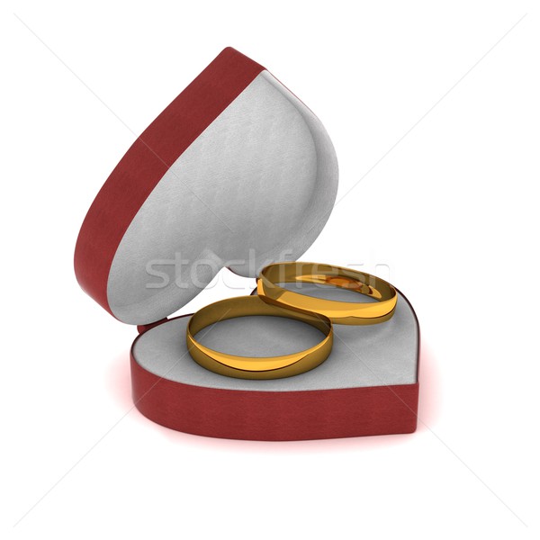 Gift box with gold rings in the form of heart. 3D image. Stock photo © ISerg