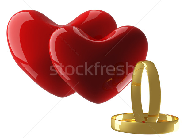 Two heart with wedding rings on a white background. 3D image. Stock photo © ISerg