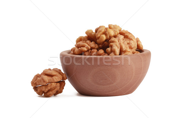Walnuts shelled in a bowl isolated on white background. Side view. Walnut kernels in a bowl. Stock photo © ivo_13
