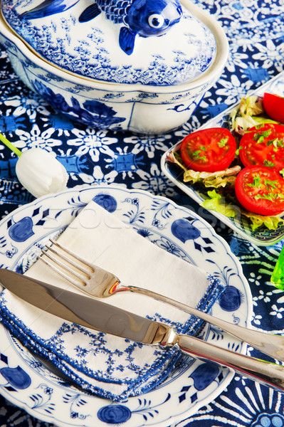 Blue crockery with fresh tomatoes Stock photo © ivonnewierink