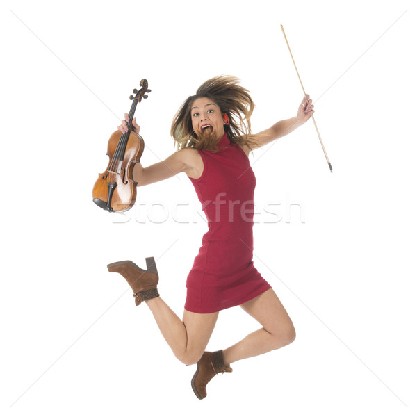 Jumping high with violin Stock photo © ivonnewierink