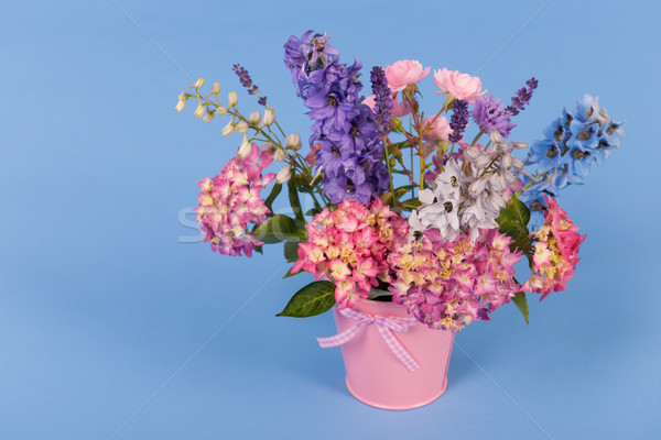 Mixed bouquet flowers on blue background Stock photo © ivonnewierink