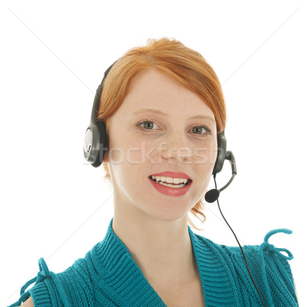 Young red haired woman with head set Stock photo © ivonnewierink