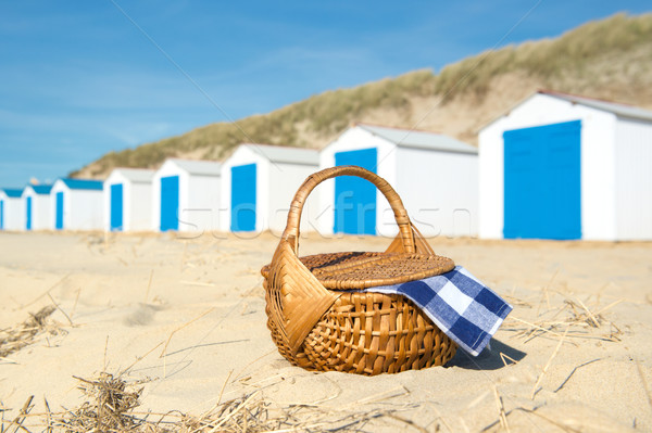 Picnic at beach with Blue huts Stock photo © ivonnewierink