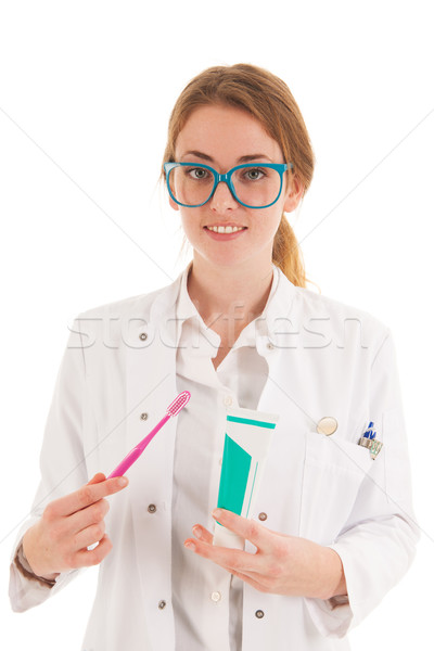 Dentist with brush and tooth paste Stock photo © ivonnewierink