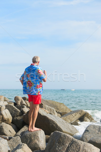 Senior man at the beach Stock photo © ivonnewierink
