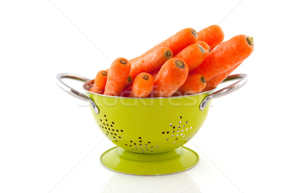 Green colander for washing carrots Stock photo © ivonnewierink