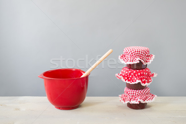 Glass pots jam and red bowl Stock photo © ivonnewierink
