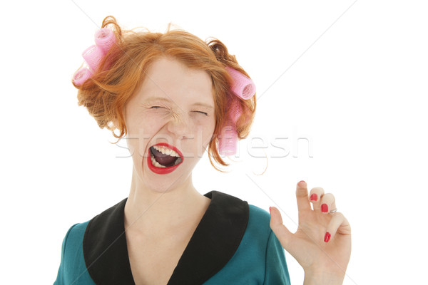 Woman with curlers in hair yawning Stock photo © ivonnewierink