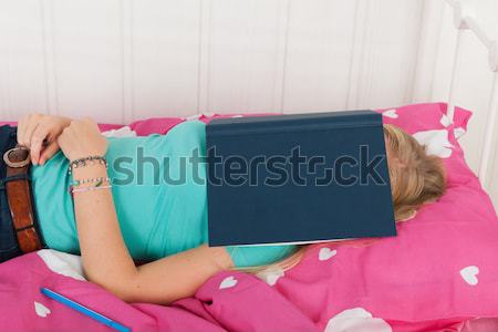 Sleeping under a school book Stock photo © ivonnewierink