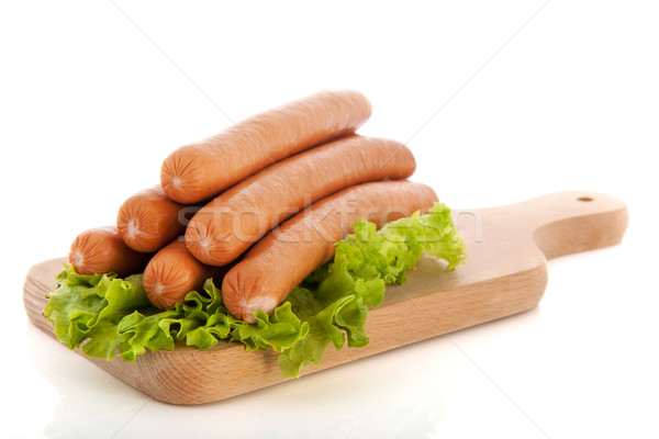 商业照片: 香肠    热    狗    木    菜板    食品 / sausages on