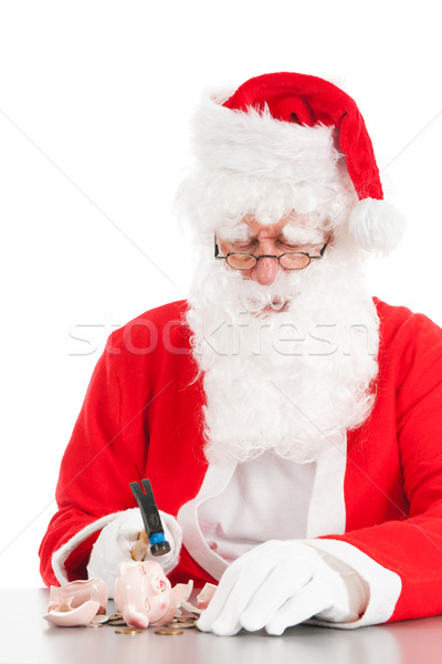 Santa breaking his piggy bank Stock photo © ivonnewierink