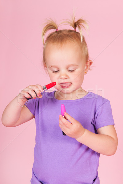 Toddler girl in pink with lipstick Stock photo © ivonnewierink