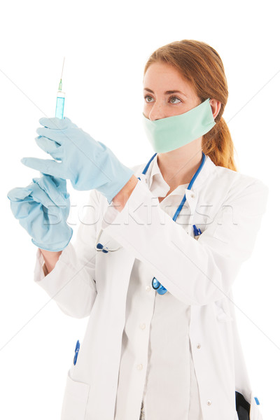 Doctor with syringe and medicine Stock photo © ivonnewierink