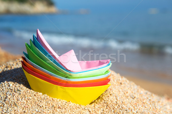 Paper boats at the beach Stock photo © ivonnewierink