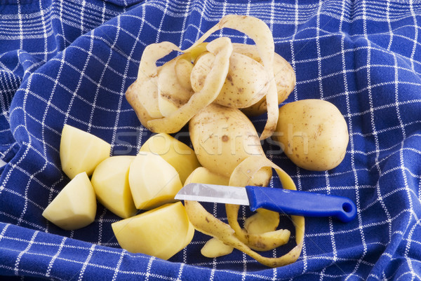Peeling potatoes Stock photo © ivonnewierink