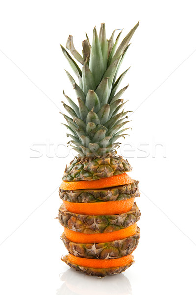 Trópusi gyümölcs ananász szeletek narancsok izolált fehér Stock fotó © ivonnewierink