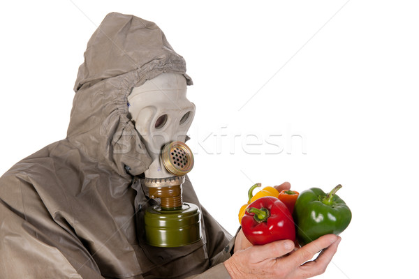 Man with gas mask and vegetables Stock photo © ivonnewierink