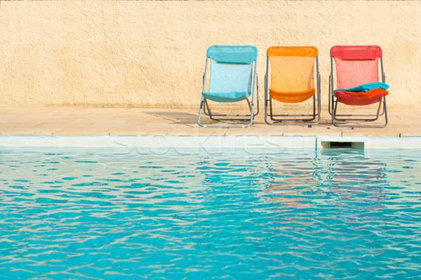 Colorful chairs at swimming pool Stock photo © ivonnewierink