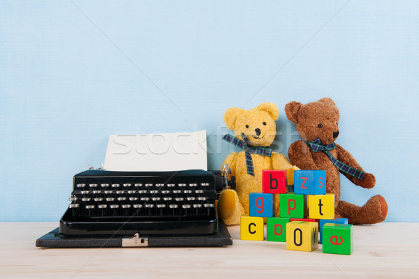 Vintage typewriter with old toys Stock photo © ivonnewierink