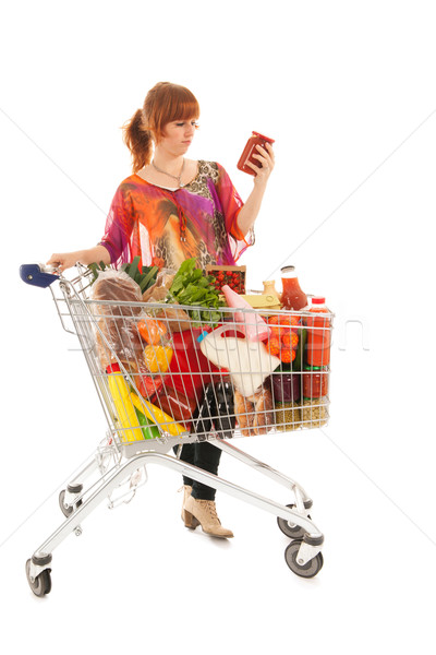 Woman with Shopping cart reading label Stock photo © ivonnewierink