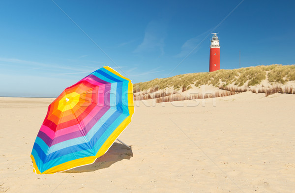 Leuchtturm Insel farbenreich Sonnenschirm Vorderseite Stock foto © ivonnewierink