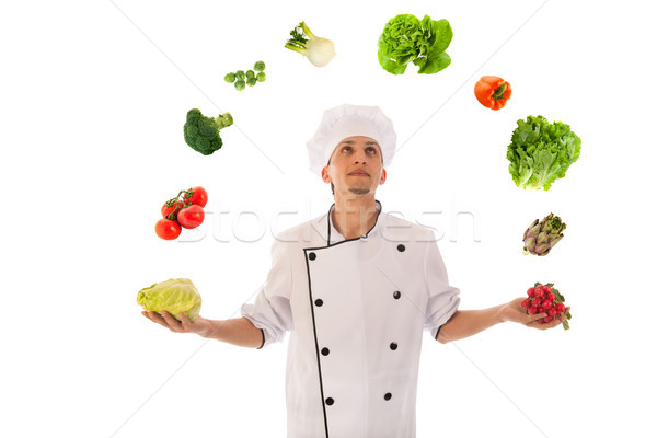 Cook juggling with fresh vegetables Stock photo © ivonnewierink